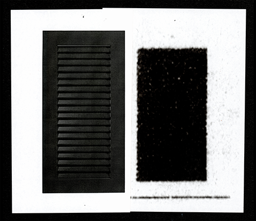 Two black rectangles on a white surface.